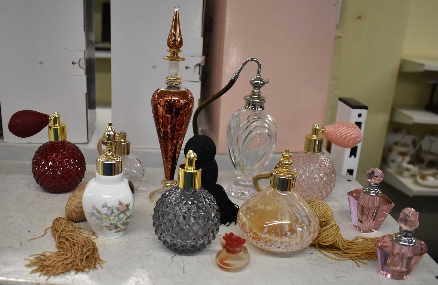 Lot 571 - A collection of ten perfume bottles.