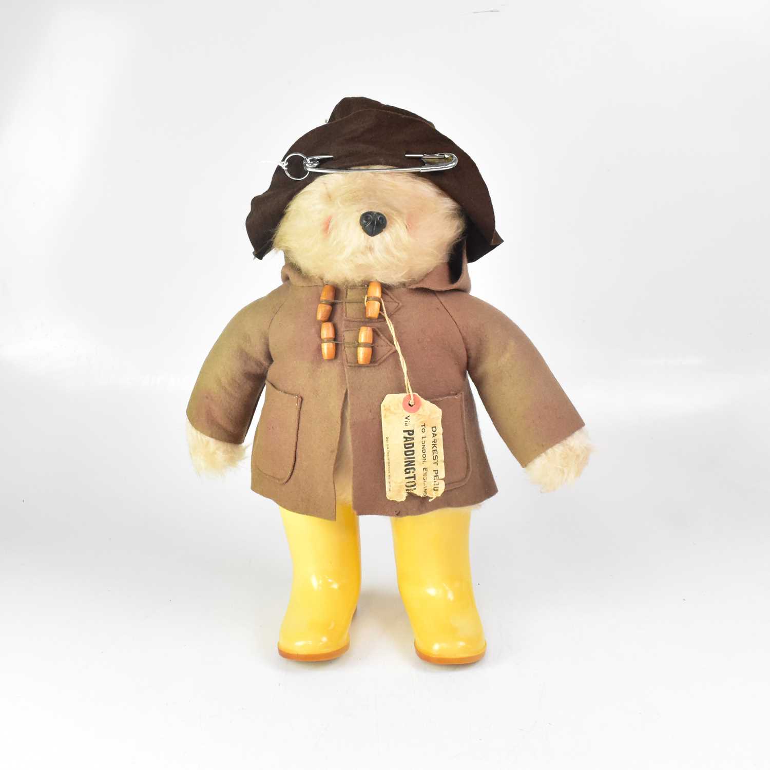 Lot 435 - A Paddington Bear plush teddy wearing duffel...