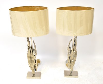 Lot 72 - A pair of contemporary silvered table lamps...