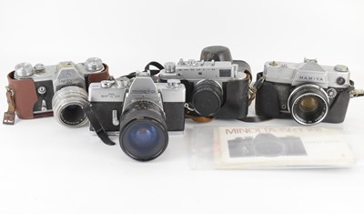 Lot 697 - Four vintage 35mm cameras comprising a...