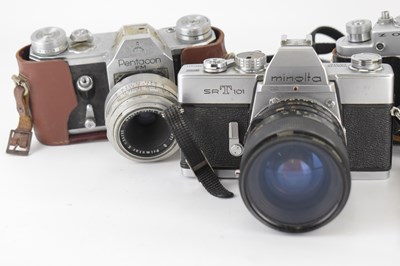 Lot 697 - Four vintage 35mm cameras comprising a...