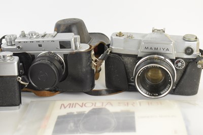 Lot 697 - Four vintage 35mm cameras comprising a...