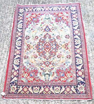 Lot 125 - A hand knotted Persian red ground woollen Qom...