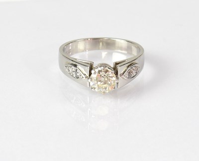 Lot 1039 - A platinum solitaire diamond ring, the diamond...