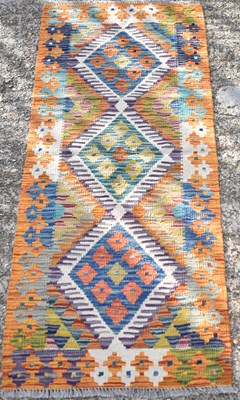 Lot 151 - A handmade woollen Chobi Kilim runner, 140 x...