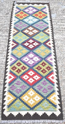 Lot 131 - A handmade woollen Maimana Kilim runner, 194 x...