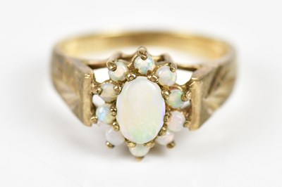 Lot 252 - A 9ct yellow gold opal ring, size O, weight 3.9g.