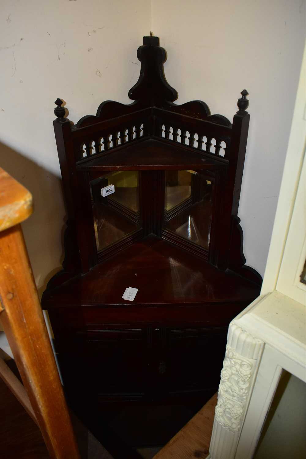 Lot 1002 - A late 19th century stained pine freestanding...