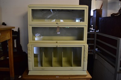 Lot 1003 - A painted three tier bookcase with glazed...