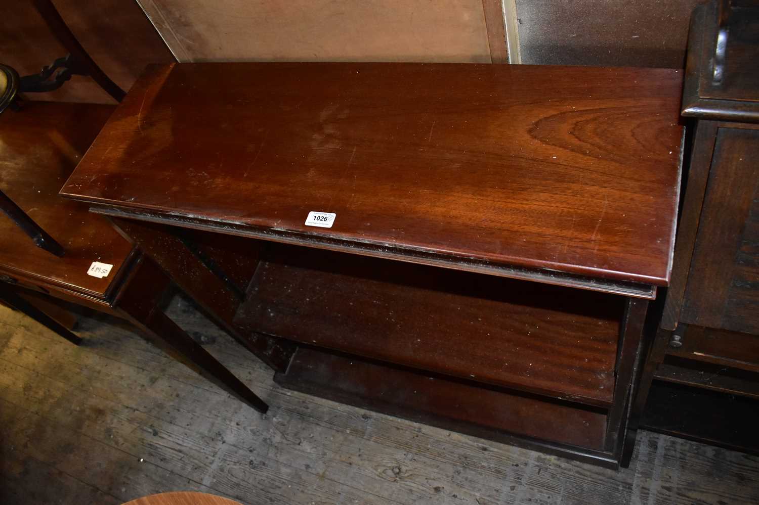 Lot 1026 - A reproduction mahogany dwarf open fronted...