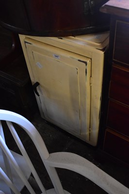 Lot 1042 - A white painted metal kitchen cabinet with...