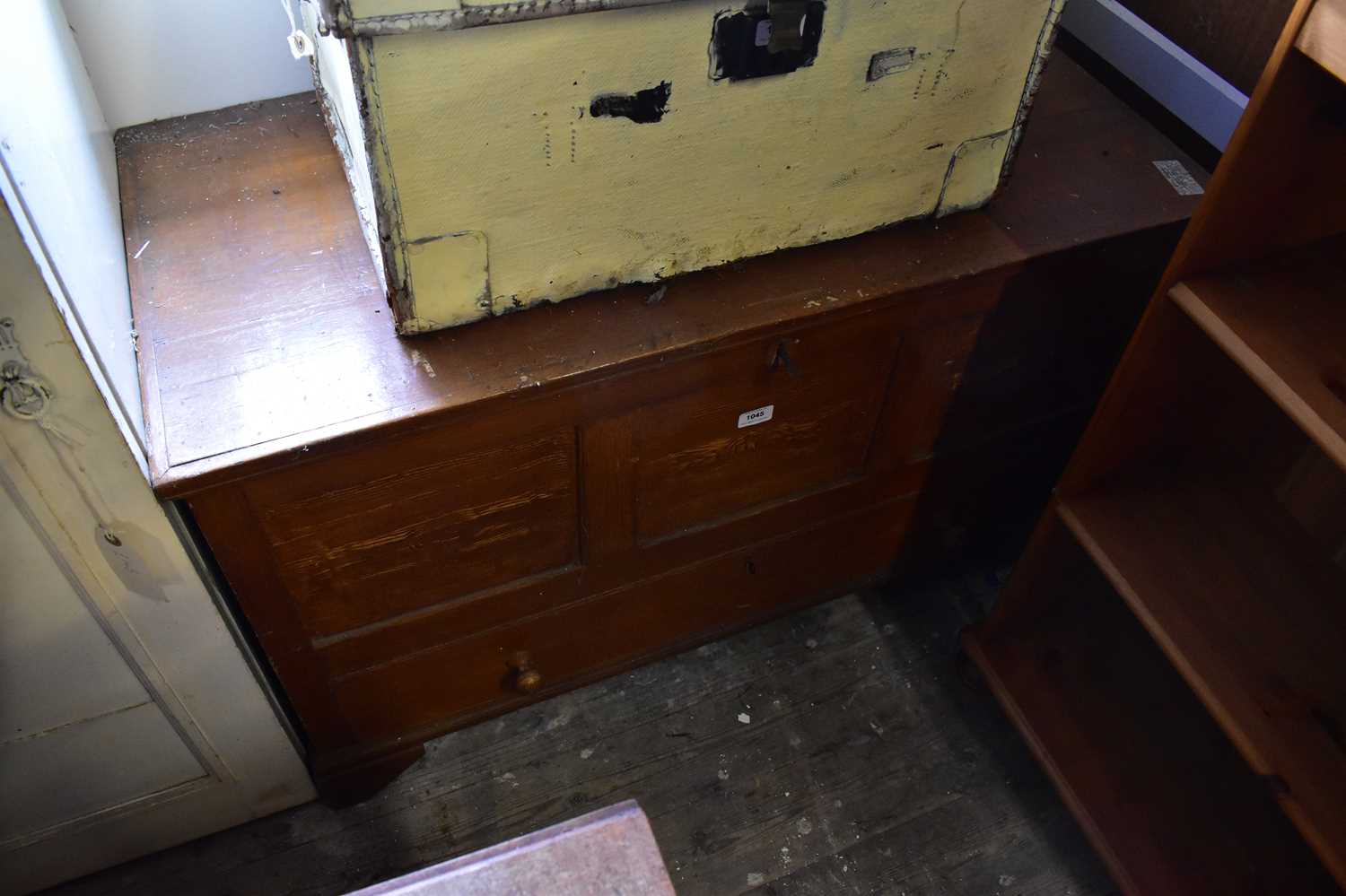 Lot 1045 - A 19th century stained pine coffer with hinged...