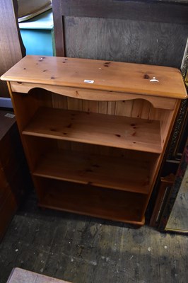 Lot 1046 - A modern pine bookcase with two adjustable...