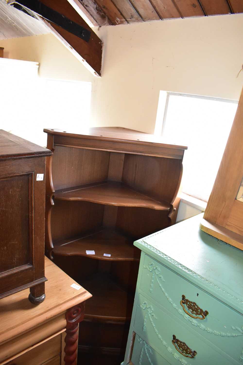 Lot 1057 - ERCOL; a freestanding corner cupboard with two...