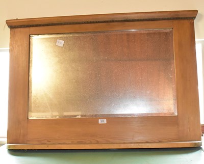 Lot 1058 - A vintage pine overmantel mirror, width 93cm.