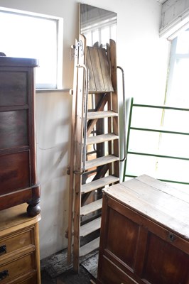 Lot 1068 - A vintage pair of wooden stepladders, together...
