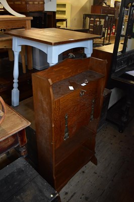 Lot 1074 - An early 20th century oak student's bureau,...