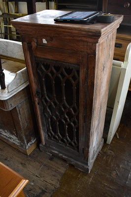 Lot 1084 - A modern hardwood cabinet with cast iron door...