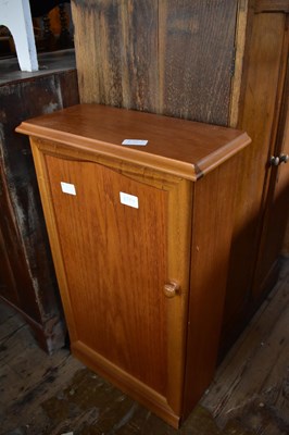 Lot 1084 - A modern hardwood cabinet with cast iron door...