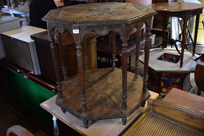 Lot 1103 - An unusual carved oak octagonal top two-tier...