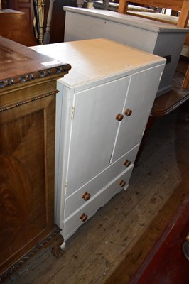 Lot 1107 - A white painted tallboy with panelled doors...