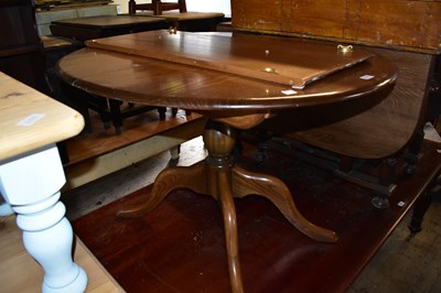 Lot 1126 - ERCOL; a medium elm extending dining table...