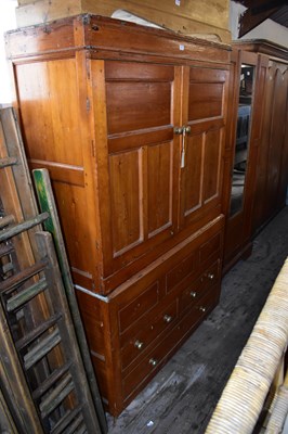 Lot 1141 - A 19th century stained pine press cupboard...