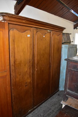 Lot 1143 - A 19th century pine three door wardrobe, with...