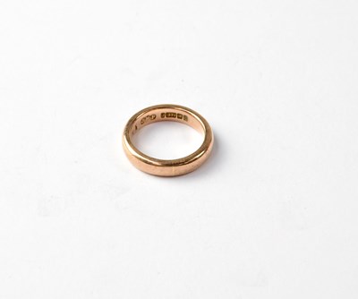 Lot 1043 - A 9ct rose gold band ring