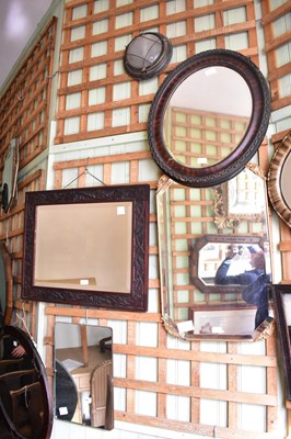 Lot 1166 - A sheet copper oval wall mirror with relief...