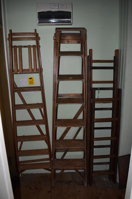 Lot 1170 - Three vintage pine ladders, together with two...