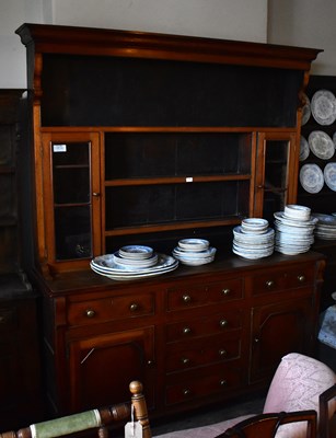 Lot 1193 - A Welsh 18th century dresser, the boarded back...