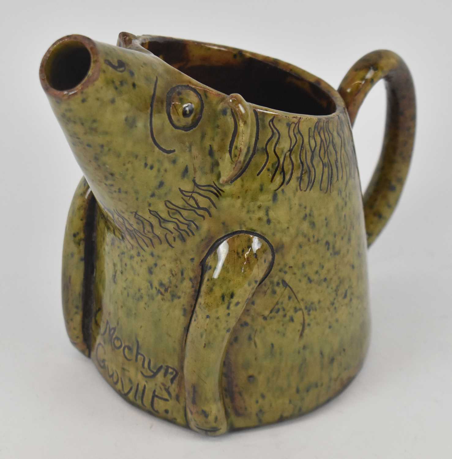 Lot 503 EWENNY POTTERY; a novelty green glazed jug