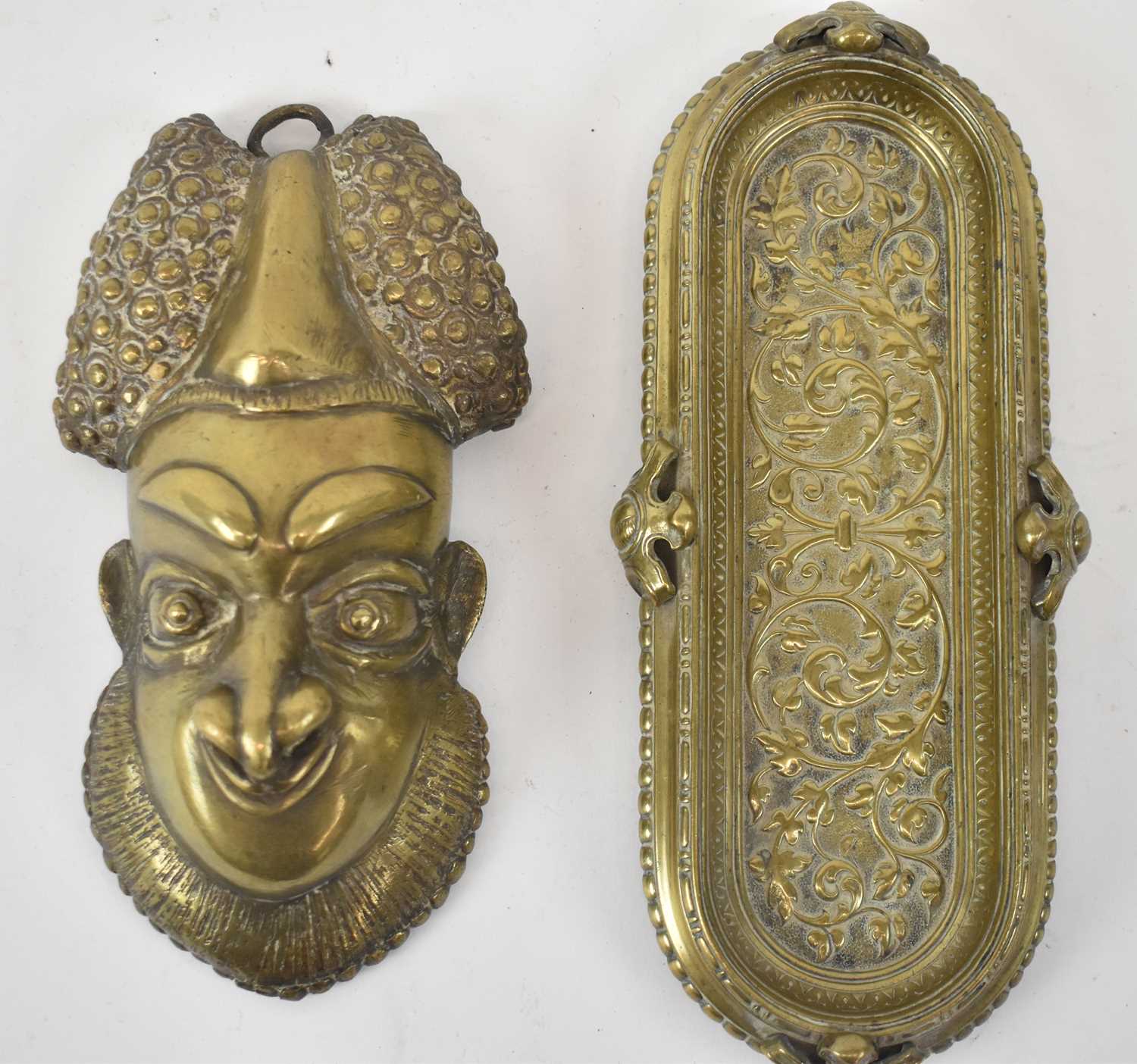 Lot 465 - A Bamoun brass mask, height 21cm and a brass