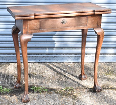 Lot 77 - A 19th century mahogany foldover card table...