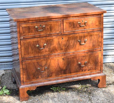 Lot 41 - An Georgian walnut and crossbanded chest of...