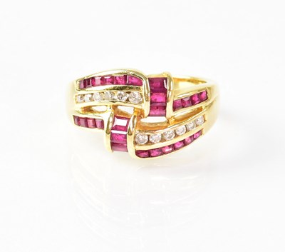 Lot 835 - An 18ct gold ring set with rubies and diamonds,...