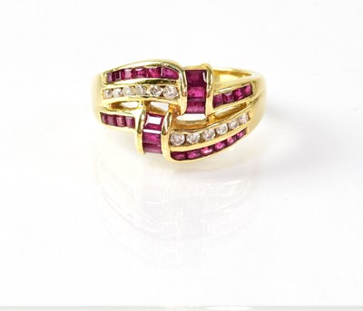 Lot 835 - An 18ct gold ring set with rubies and diamonds,...