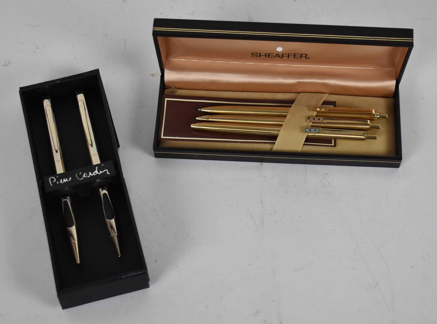 Lot 314 - PIERRE CARDIN; two boxed pens and a set of...