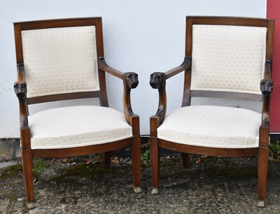 Lot 19 - A pair of mahogany open arm elbow chairs with...