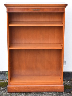 Lot 93 - A reproduction yew wood freestanding bookcase...