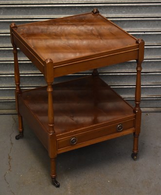 Lot 110 - A reproduction yew two tier lamp table.