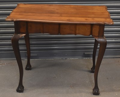 Lot 56 - An early 20th century walnut centre table on...