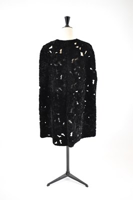 Lot 10 - ELIE SAAB; a black 100% shearling floral cape,...