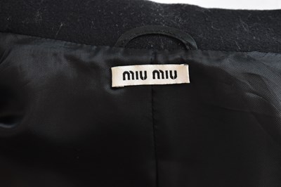 Lot 12 - MIU MIU; a short black 100% wool fitted jacket,...