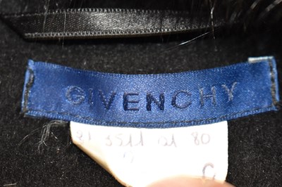 Lot 18 - GIVENCHY; a black wool short fitted jacket...