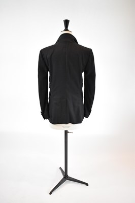 Lot 22 - GUCCI; a dark grey wool mix fitted blazer,...
