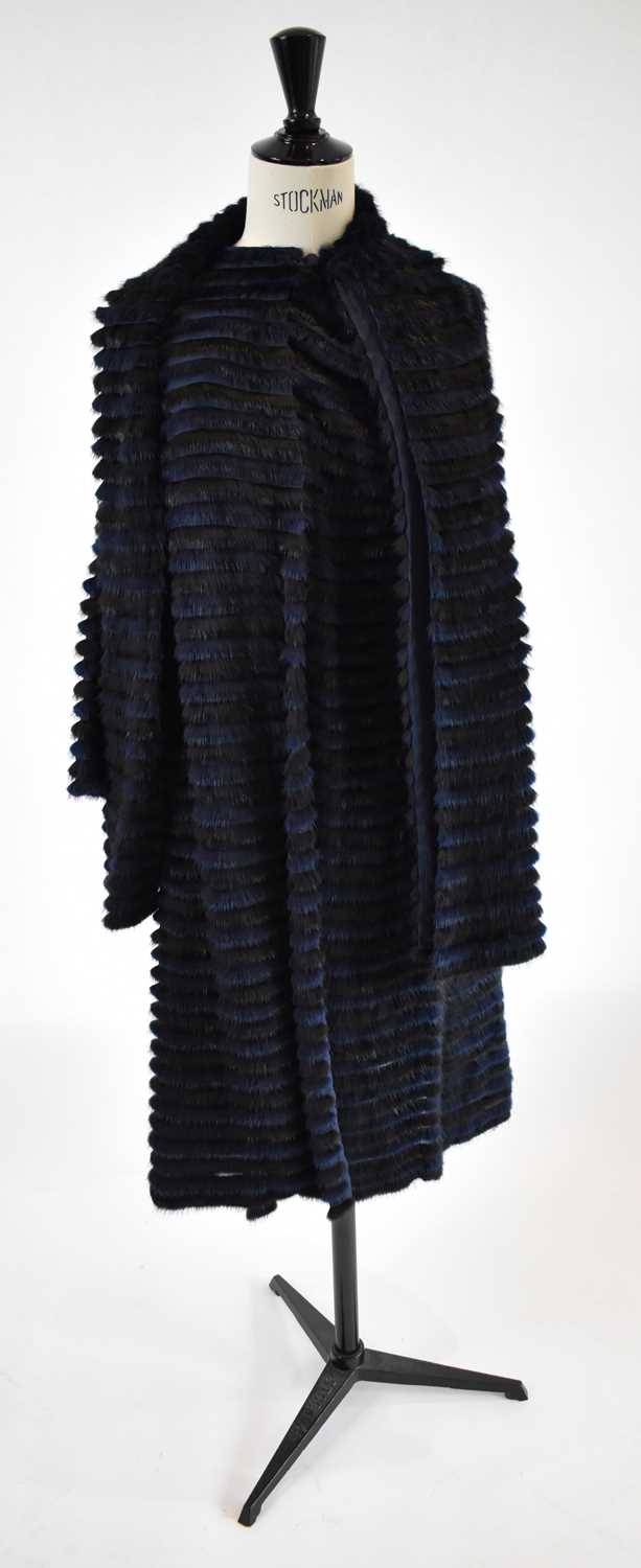 Lot 29 - A navy blue and black striped fur and silk...