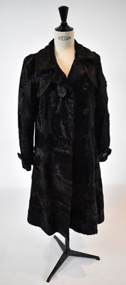 Lot 30 - A dark brown full length fur coat, size 36.