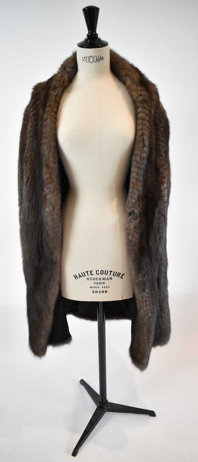 Lot 31 - A brown full length fur coat, size 38.
